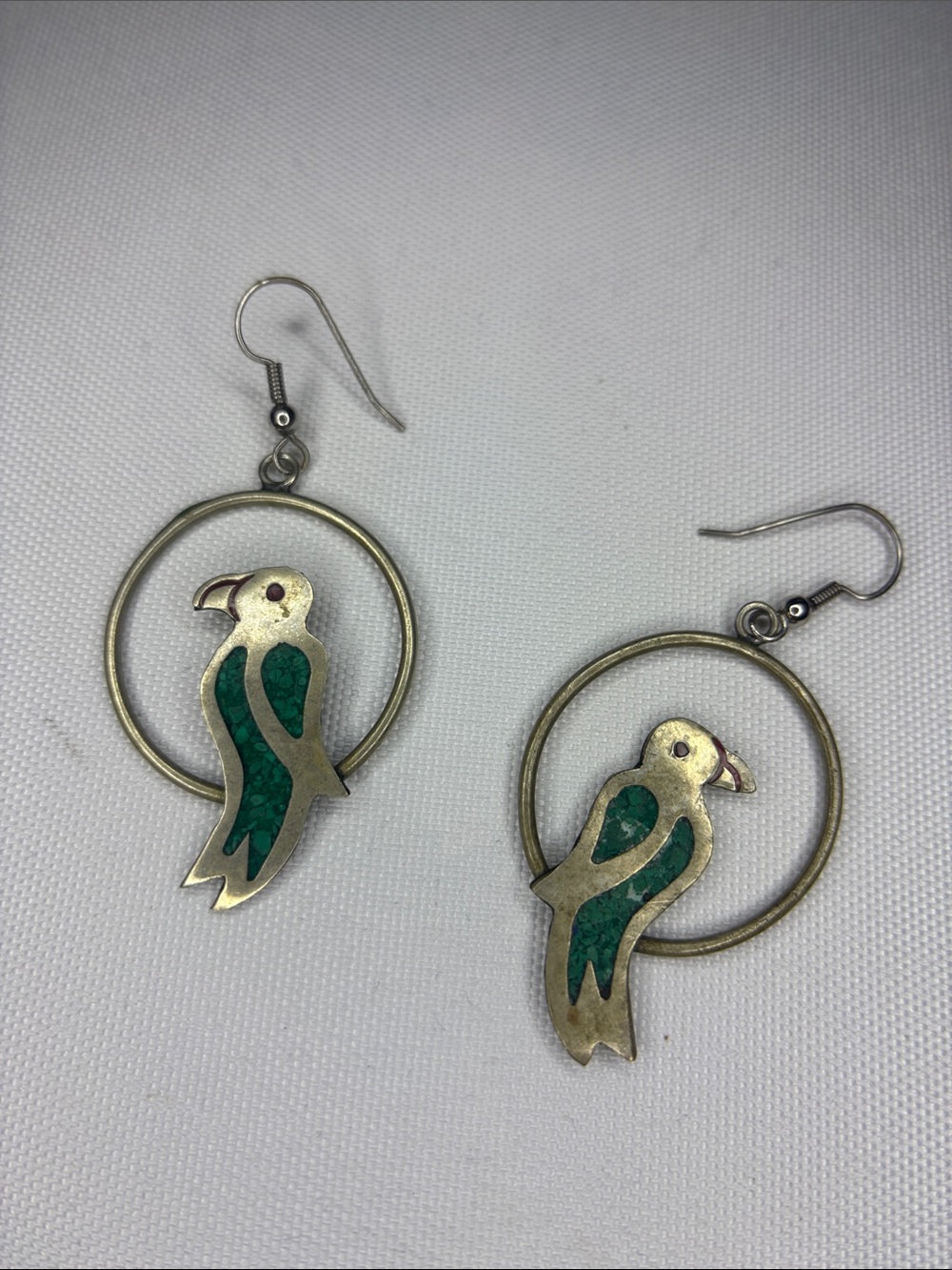 alpaca turquoise inlay stamped parrot silver earrings